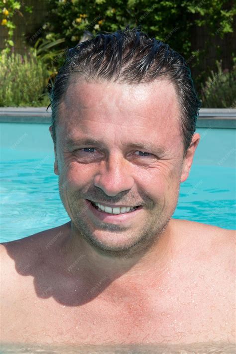 Premium Photo | Handsome middle aged man portrait in water swimming in outdoor pool