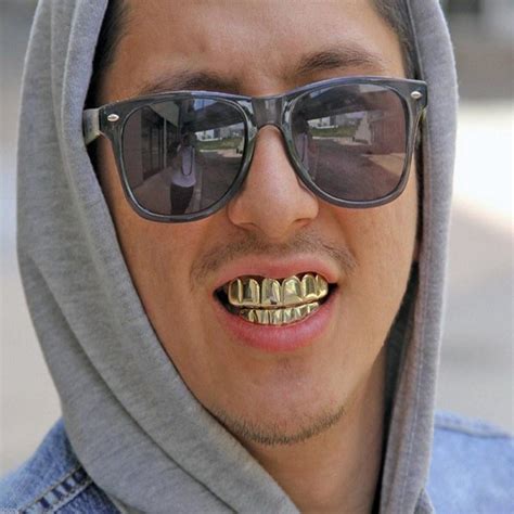 Why Do Rappers Wear Gold Teeth - Live Enhanced