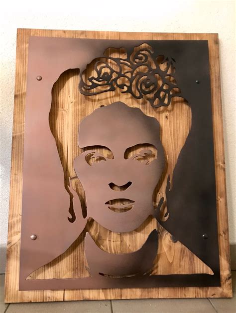 Decorative picture made from steel & wood was situated in stylish Frida ...