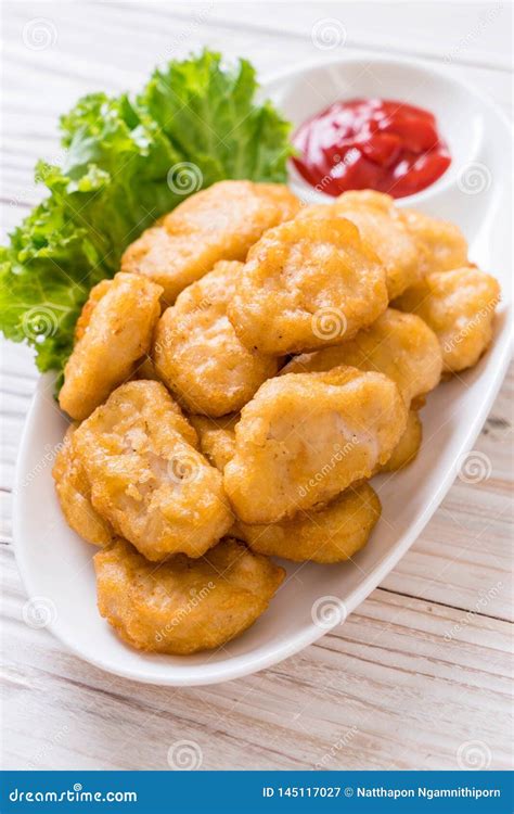 Chicken nuggets with sauce stock image. Image of nugget - 145117027