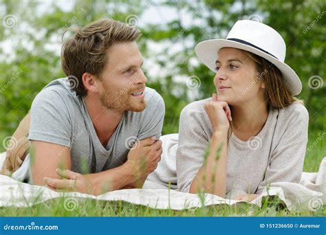 Beautiful Couple Laying on Grass Stock Photo - Image of summer, male: 151236650