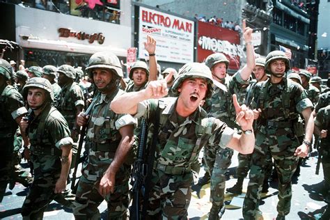 U.S. Marines who participated in the Persian Gulf War celebrate during the victory parade of ...