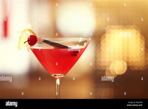 Glass of cocktail on bar background Stock Photo - Alamy