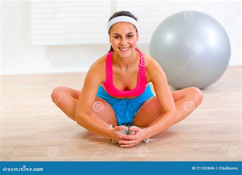 Smiling Girl Doing Stretching Exercises At Home Royalty Free Stock Image - Image: 21102846