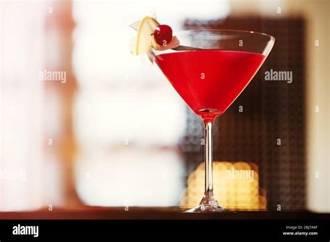 Glass of cocktail on bar background Stock Photo - Alamy