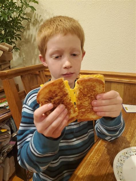 My 7yo showing off the first grilled cheese he cooked himself : grilledcheese