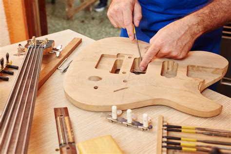 Guitar making with wood stock photo. Image of construction - 120482552