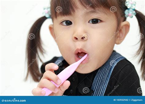 Japanese Girl Brushing Her Teeth Stock Photo - Image of three, brushing: 103932942