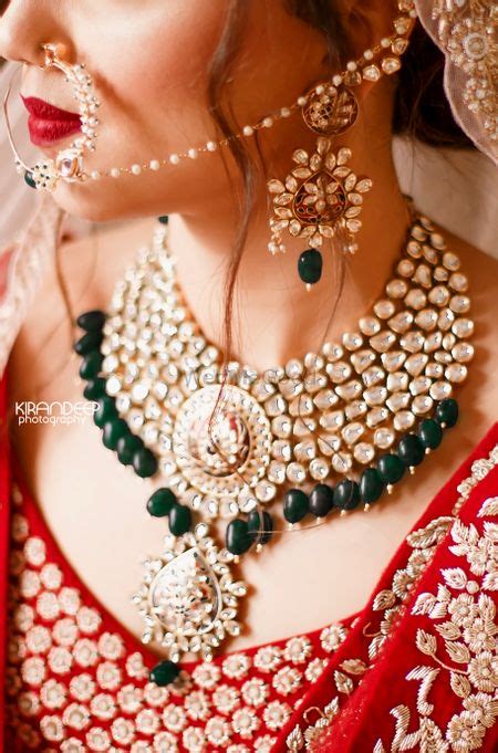 Photo of Sikh bride in gold and coral anarkali with kaleere