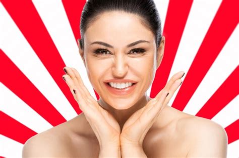 Premium Photo | Cheerful beautiful woman face portrait close up over red and white geometric ...