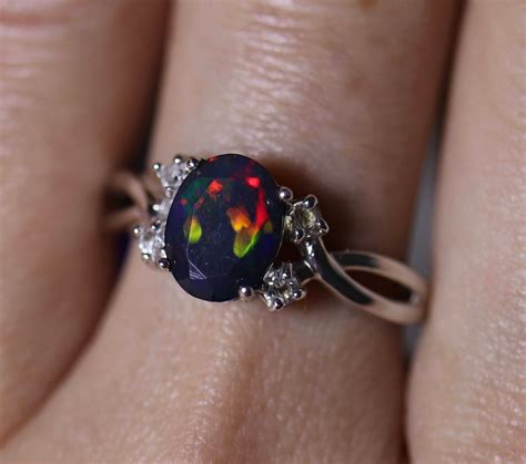 Natural black fire opal engagement ring made w white topaz accent stones on both sides and a ...