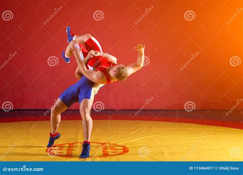 Two young men wrestlers stock image. Image of muscular - 113464977