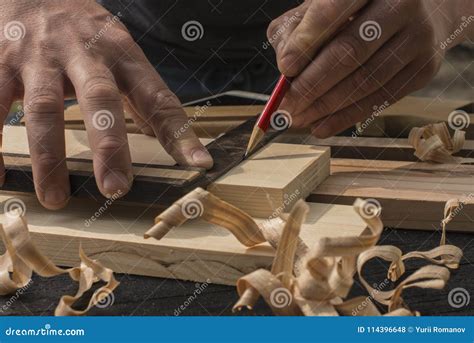 The Carpenter Marks with a Red Pencil a Plank Stock Photo - Image of sleeves, adult: 114396648