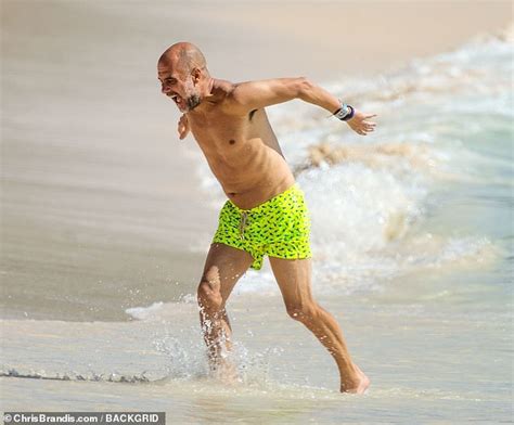 Feeling the chill, Pep?! Manchester City boss Guardiola enjoys a well-earned family holiday in ...