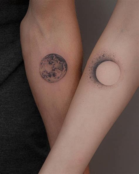 Matching full moon and eclipse tattoos for couple.