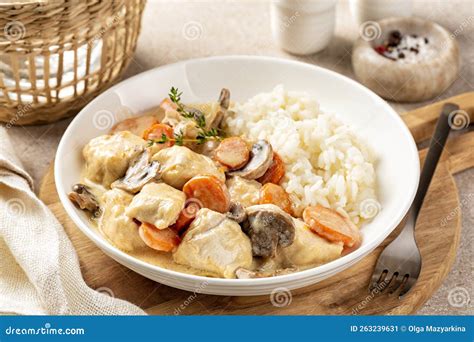 Blanquette De Poulet with Rice, French Chicken Stew with Carrots, Mushrooms, Onion. Simmered in ...