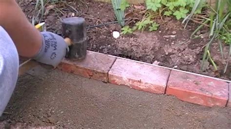 Laying a block edge course | Brick flower bed, Brick garden edging, Flower bed edging
