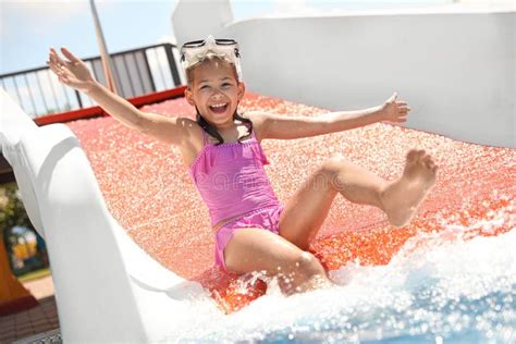 Girl on Slide at Water Park. Summer Vacation Stock Image - Image of beautiful, primary: 193298873