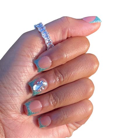 Dazzling aqua blue reflective glitter french tips! This set is 100% ...