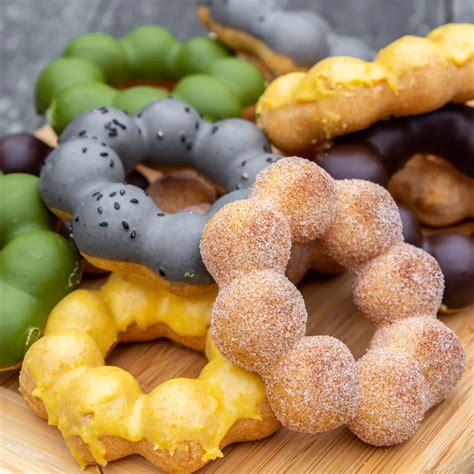 Mochill - mochi donuts piled on cutting board - Nomtastic Foods