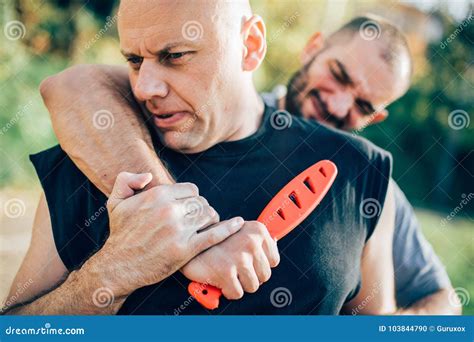 Self Defense Disarming Technique Against Threat and Knife Attack Stock Photo - Image of knife ...