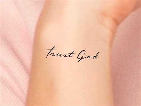 in god i trust wrist tattoo - alexanderthegreatpaintings