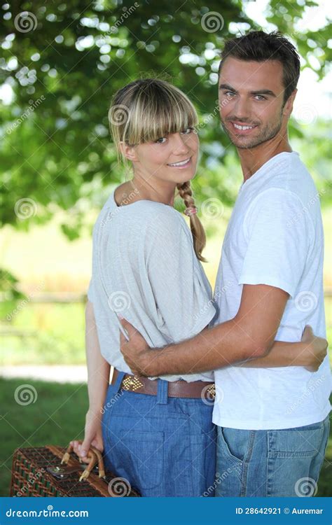 Couple with picnic basket stock image. Image of pursuit - 28642921