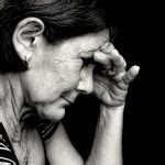 The sad old woman on the black — Stock Photo © voronin-76 #2541754