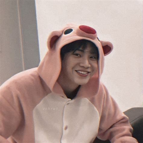 a person in a pink bear costume sitting down