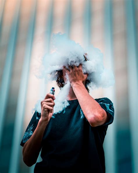 Selective Focus Photography Of Man Doing Vape Trick · Free Stock Photo