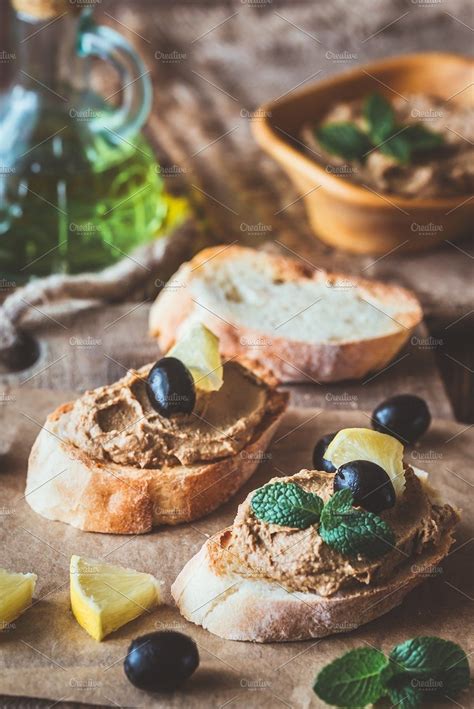 Toasts with chicken liver pate containing antipasti, antipasto, and ...