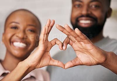 Love, hands in heart and happy black couple for relationship, dating and commitment in home ...