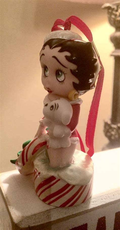 Danbury Mint collection of Betty Boop ornaments, CHRISTMAS SURPRISE. Betty and her dog are ...