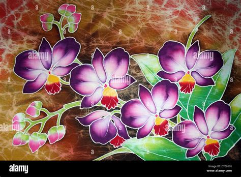 Purple Orchids On A Malaysian Batik Stock Photo - Alamy