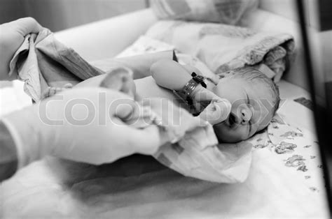 Black and white shot of newborn baby ... | Stock Photo | Colourbox