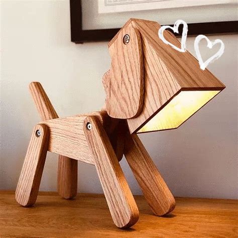 a wooden dog lamp sitting on top of a table