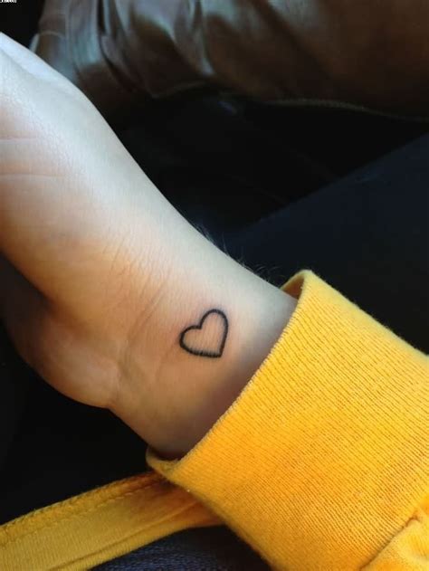 cute outline heart wrist tattoo cute heart tattoo on hands | Hand heart tattoo, Heart tattoo ...