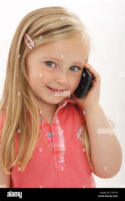 Young child holding a blackberry smart phone Stock Photo - Alamy