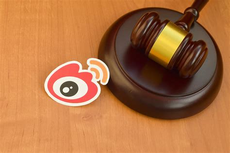 Weibo paper logo lies with wooden judge gavel. Entertainment lawsuit concept 29620006 Stock ...