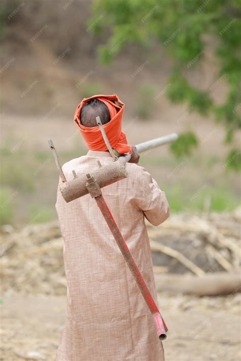 Premium Photo | Indian farmer and a yoke of oxen farming in india happy ...