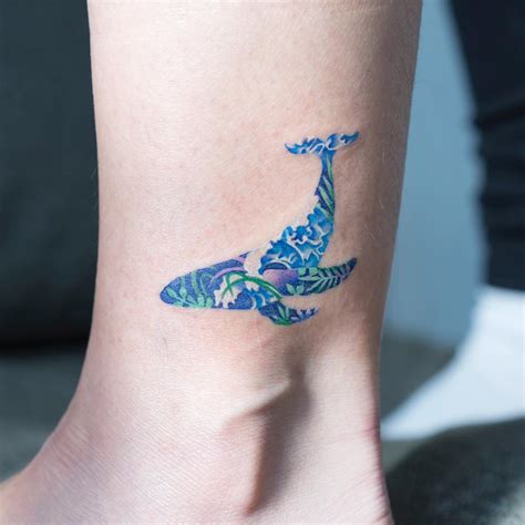 Floral blue whale tattoo - Tattoogrid.net