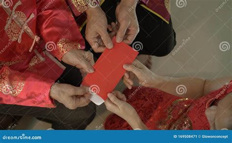 Giving Red Envelop for Chinese New Year Top View Grandparent and Five Money To Child Stock Image ...