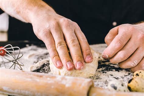 Premium Photo | Hands kneading a dough