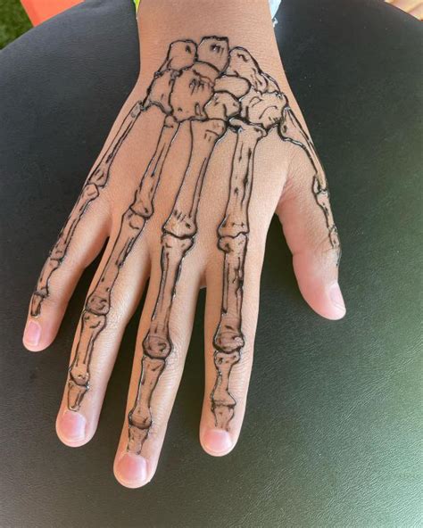 60 Skeleton Hand Tattoo Ideas with Meaning