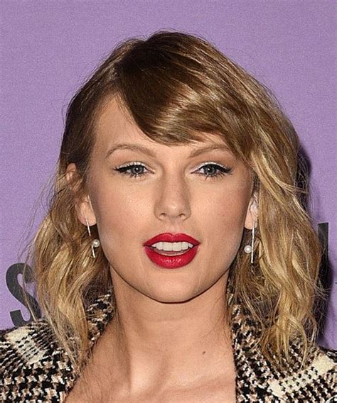 Taylor Swift Medium Wavy Brunette Hairstyle with Side Swept Bangs and ...