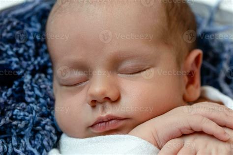 Little baby boy sleeping in a basket on the wooden floor, studio shot. Close-up 35754924 Stock ...