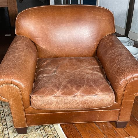 BROWN LEATHER ARMCHAIR & OTTOMAN