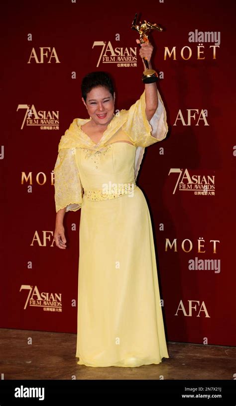 The Philippines actress Nora Aunor poses with her trophy after winning the Best Actress Award of ...