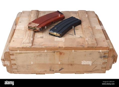 m16 and ak47 magazins on wooden army ammo box isolated on white background Stock Photo - Alamy