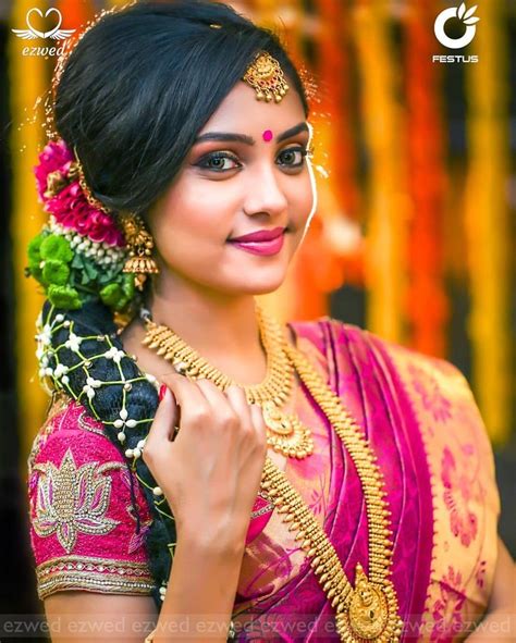 South Indian bride. Gold Indian bridal jewelry.Temple jewelry. Jhumkis.Pink silk kanchipuram ...